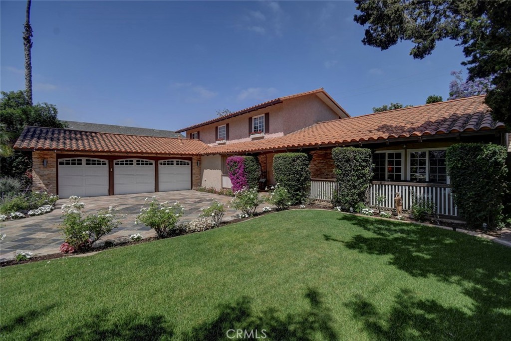 Charming and spacious North Tustin family home. This four bedroom, three bath home is nestled in a quiet cul-de-sac. Located within the highly sought after Foothill High School boundary, this hidden gem offers the perfect blend of comfort, space and style. The expansive back yard offers a sparkling pool, relaxing jacuzzi, plus plenty of beautiful and lush lawn and gardens. Large entertainers BBQ area with seating for 14 people. With a family-friendly lay out, abundant natural light, and endless possibilities for indoor-outdoor living, this home is ready for its next chapter. Master bedroom and bath-suite are on the first level, with patio access, additional three bedrooms upstairs. Open kitchen and dining floorplan. A must see...This home has it all!