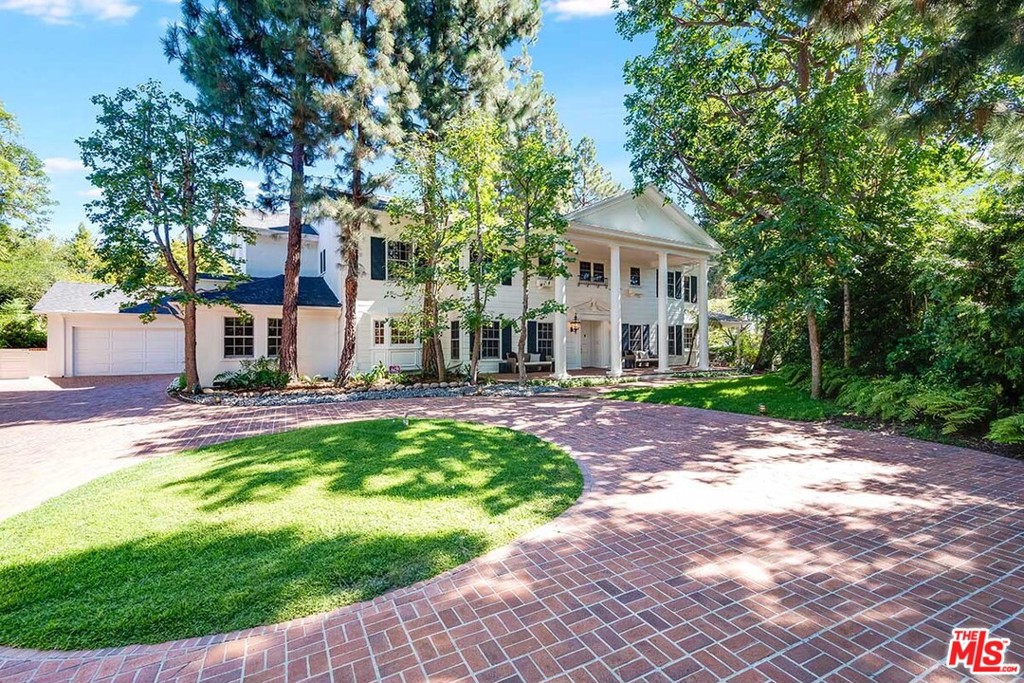 Private and gated, this exquisite traditional Colonial estate offers elegant curb appeal, an expansive brick motor court and stately facade. The floor plan features an elegant foyer which opens to a formal dining area on one side and a formal living room on the other, with fireplace and french doors. The dining area flows to the updated gourmet kitchen, with center island and best in class appliances including SubZero, Wolf and leads to an ample butlers pantry. The home features 5 impressive ensuite bedrooms, 4 up and 1 down including dual master suites. Enjoy relaxed evenings in the cozy den surrounded with warm wood paneling, fireplace and wet bar. This impressive Old Hollywood Estate is set on beautiful, lush grounds encompassing brick patios, sunny courtyard, Koi pond, pool and pool house. An entertainers dream with top of the line outdoor kitchen, outdoor fireplace, temperature controlled wine cellar, bbq area, pool and pool house. 11610 Bellagio offers a luxurious way of life.