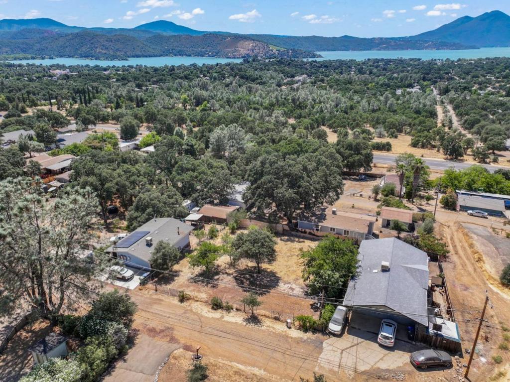 Look at this property! Discover your perfect getaway or year-round residence in this lovely homesite, ready to build or set a mobile home, ideally situated near the beautiful Clear Lake with a beautiful view, perfect for fishing and outdoor activities. This property boasts a spacious lot and an open floor plan. Property Highlights: - Ample space for family and guests. - Enjoy a bright and airy living area, plenty of trees for shade for perfect for entertaining, and parking all your toys and RV. - The property has all utilities included; the previous mobile home was removed, and it is clear and ready to build your getaway. The property is a quarter acre, Close to downtown, and the main highway 53, has easy access. This deal won't last!