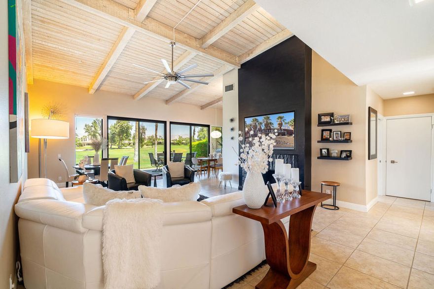 Prime location for this exquisitely updated and turnkey furnished condo in the Indian Wells Country Club! The striking furniture reflects the modern contemporary design of this newly upgraded condo.  Location is key on the golf course with lighted mountain views.  3 bedrooms, 3 bath condo with an open view of the 18th Green of the Cove Course.  Definitely one of the best views in the prestigious IWCC.  2 AC units and 2 water heaters. Newly remodeled kitchen with new refrigerator, newly installed double dishwasher; Quartz Counters and new pantry. Dual-pane sliders and windows throughout. Bar with icemaker and deep sink. Gas fireplace in the living room. Newly installed fans, lights and speakers throughout. New carpet in bedrooms.  Bathrooms with double sinks and showers.  Indoor laundry. Misting System on back patio.  2 car plus golf cart garage with epoxy floor and insulated garage door.  No stone unturned with this upscale remodel. Club membership is optional with several types of memberships. A member can take a short walk or ride to The Cove Clubhouse for Happy Hour or dinner. Enjoy the heated pool and spa nearby. Immediately enjoy the Indian Wells City Perks with discounts on restaurant, golf, usage of Fitness Center at the Hyatt and free BNP Tennis tickets.  This condo will not disappoint. Move in and enjoy life!!