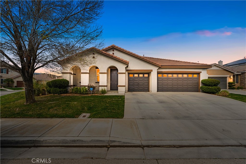 Sophisticated Single-Story Sanctuary in Rancho Vista
Welcome to this exquisite 2,684 square foot residence nestled in the desirable Rancho Vista community. This meticulously maintained four-bedroom, three-bathroom home offers a thoughtfully designed single-story floor plan that provides both openness and privacy for all occupants.
The intelligent layout creates distinct wings throughout the home, ensuring tranquility and personal space. Upon entry, you'll discover a private bedroom with its dedicated bathroom—an ideal arrangement for guests, in-laws, or older children seeking independence. The remaining bedrooms are situated near the primary suite, creating a harmonious sleeping quarters arrangement.
Natural light cascades through the home, illuminating the carefully crafted interior spaces. The gourmet kitchen stands as the heart of this residence, featuring a practical double oven, abundant counter space for culinary creativity, and generous storage solutions for all your kitchenware and pantry needs.
Step outside to discover an expansive backyard—a blank canvas awaiting your personal touch, whether that means entertaining spaces, gardening endeavors, or recreational areas for the entire family.
This property enjoys an enviable location just minutes from the prestigious Rancho Vista Golf Course, with Rancho Vista Park less than a mile away for outdoor recreation. Education options abound with Paraclete High School in the vicinity.
The home presents in move-in condition, allowing you to simply unpack and begin creating memories in your new Rancho Vista residence. Don't miss the opportunity to secure this single-story gem in one of Palmdale's most coveted neighborhoods.