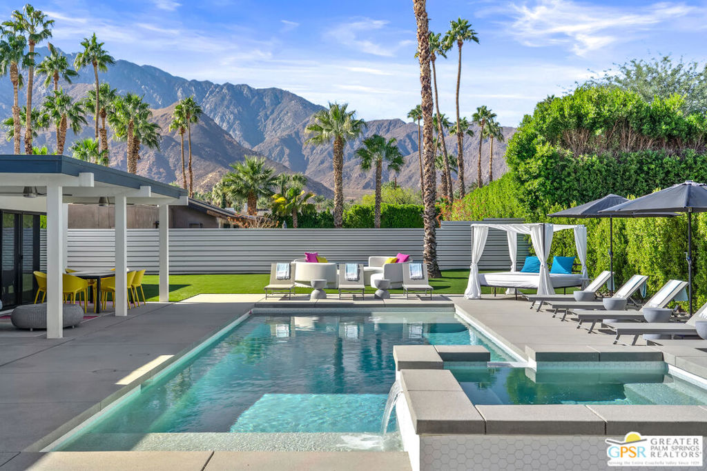 Fully renovated, turnkey vacation home in prime Palm Springs location! Welcome to 888 E El Conquistador, your fully furnished desert retreat just minutes from the heart of downtown Palm Springs! This stunning 3-bedroom, 2-bath home has been completely updated and is being sold fully equipped. Everything you see stays, making it a true turnkey opportunity for investors or second-home seekers. Already backed by a strong property management team that will help you navigate the rental process for seamless operation, offering a hassle-free investment opportunity. Currently a top-performing short-term vacation rental, this completely remodeled property boasts a brand new pool, spa, fire pit, HVAC system, roof, reverse osmosis water filtration system, and dual-paned windows and doors, offering peace of mind and modern comfort. Inside, the open-concept layout flows effortlessly from a stylish kitchen with waterfall terrazzo countertops, to spacious living areas designed for entertaining or relaxing in style in front of the new, gas fireplace. Step outside to your private backyard paradise featuring a sparkling pool and spa, ample seating around the fire pit or outdoor living room, and breathtaking mountain views, ideal for soaking up the sun or enjoying evenings under the stars. This move-in-ready gem with fully owned solar (including battery storage with two Tesla Power walls, and a Telsa EV charger as well!) checks all the boxes. Ideal for both homeowners and investors. Act quickly to take advantage of peak rental season demand. Don't miss this opportunity!