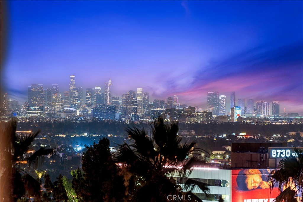 A One-of-a-Kind Reimagined Penthouse Just Off the Iconic Sunset Strip!
This ultra-luxury corner penthouse has been completely remodeled—no detail overlooked, no expense spared. Featuring direct private elevator access, you’ll step into a fully customized open-concept home that exudes sophistication and quality.
Highlights include a gourmet kitchen with custom cabinetry, imported London clay farmhouse sink, stone countertops, Dacor appliances (fridge, freezer, induction cooktop), and a Miele dishwasher. The entire unit is pre-wired for smart entertainment, and outfitted with soundproofing throughout, including a custom soundproof front door at the elevator entrance.
The master suite features a custom walk-in closet, spa-like en-suite bath, and a stunning Napoleon fireplace. All closets are high-end custom builds from The Container Store’s top line. Beautiful floors with special wood laminate finish span the home.
The upstairs loft/office space leads to a private rooftop terrace with panoramic city views. The outdoor kitchen is an entertainer’s dream, With retractable glass doors from a luxury design firm in Laguna Beach.
Every element of this penthouse speaks to quality, privacy, and elevated living. An exceptional property for those who demand the best.