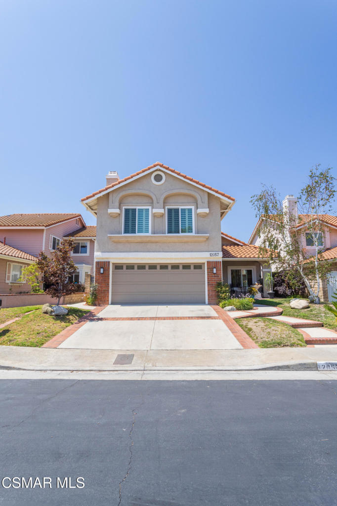 Porter Ranch Executive Home with Stunning ViewsLocated in the prestigious 24/7 guard-gated community of Porter Ranch, this elegant 4-bedroom, 3-bath home offers breathtaking mountain and city light views. The dramatic entry features soaring ceilings, a spiral staircase, and wood floors leading to formal living and dining rooms. The spacious kitchen includes stainless steel appliances, a walk-in pantry, and a breakfast area that opens to the family room with a fireplace, wet bar, and built-ins. Double-pane French doors lead to a private backyard retreat with a covered patio, mature landscaping, and panoramic views. Upstairs, the primary suite boasts dual walk-in closets, a balcony with sunset views, and a spa-like bath with jetted tub and separate shower. A large bonus room with fireplace offers endless possibilities. Additional features include a downstairs bedroom and bath, finished garage with epoxy floors and EV charger, and energy-efficient windows. Resort-style amenities include 2 pools, tennis, basketball, volleyball, playgrounds, and lush park-like grounds. All just minutes from The Vineyards, award-winning schools, hiking trails, and the 118 Freeway.