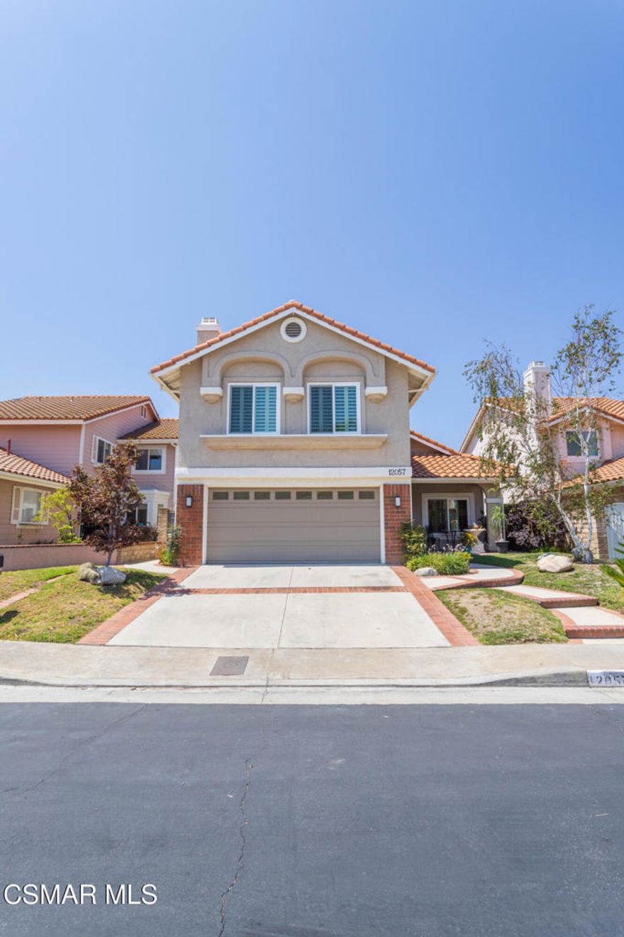 Porter Ranch Executive Home with Stunning ViewsLocated in the prestigious 24/7 guard-gated community of Porter Ranch, this elegant 4-bedroom, 3-bath home offers breathtaking mountain and city light views. The dramatic entry features soaring ceilings, a spiral staircase, and wood floors leading to formal living and dining rooms. The spacious kitchen includes stainless steel appliances, a walk-in pantry, and a breakfast area that opens to the family room with a fireplace, wet bar, and built-ins. Double-pane French doors lead to a private backyard retreat with a covered patio, mature landscaping, and panoramic views. Upstairs, the primary suite boasts dual walk-in closets, a balcony with sunset views, and a spa-like bath with jetted tub and separate shower. A large bonus room with fireplace offers endless possibilities. Additional features include a downstairs bedroom and bath, finished garage with epoxy floors and EV charger, and energy-efficient windows. Resort-style amenities include 2 pools, tennis, basketball, volleyball, playgrounds, and lush park-like grounds. All just minutes from The Vineyards, award-winning schools, hiking trails, and the 118 Freeway.