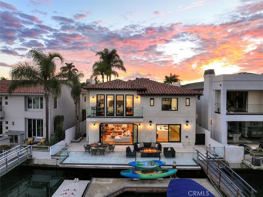 Discover waterfront living in this newly remodeled bayfront residence on Linda Isle, Newport Beach’s premier guard-gated community.  A private dock accommodates approx 62’ yacht plus two side ties, setting the stage for Newport Harbor’s  boating lifestyle. Taken to the studs and spanning 4,083 square feet, the stunning home features  four spacious bedrooms and four-and-a-half baths.  The layout includes a private casita above the garage, complete with its own living area, bedroom, bath, kitchenette, and laundry. Just inside the sleek private gateway, is a tranquil courtyard that showcases the home’s indoor-outdoor flow. The expansive bayside great room, with its polished fireplace, opens to a waterfront patio with 51’ of  frontage, an ideal setting for entertaining or unwinding. The primary suite offers panoramic harbor views, a generous sitting area, and a spa-inspired retreat.  Linda Isle offers unmatched privacy, security, and community with a 24-hour guard gate, tennis court, clubhouse, and children’s beach. Minutes from Fashion Island, John Wayne Airport, and world-class dining, this exclusive enclave of 107 waterfront homes is perfectly positioned to embrace the best of coastal living.