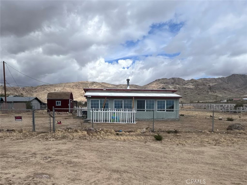 One acre home with 2 bedrooms, 2 bathrooms, a bonus room, that can be used as an office or game room. Plenty of space for entertaining. Shed included. All appliances included. Enclosed patio with plenty of windows for great natural lighting.