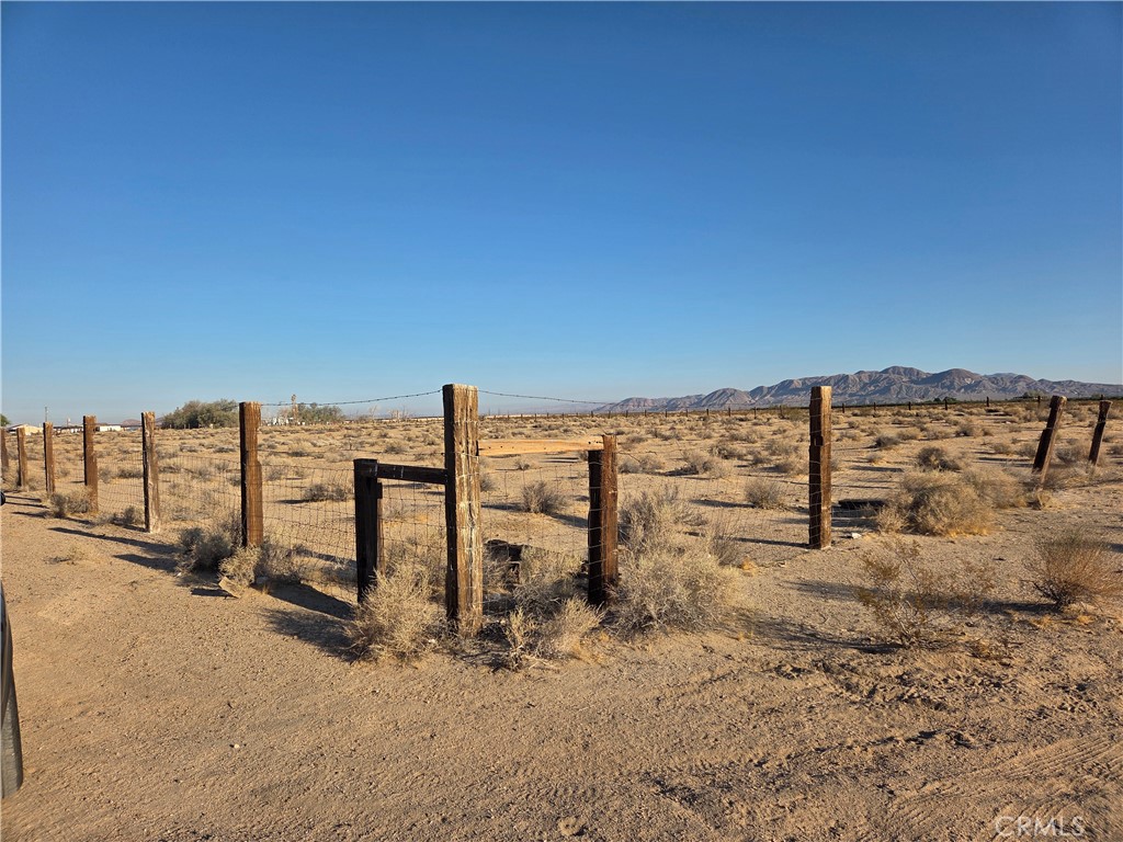 Five-acre parcel located at the corner of Mineola Rd and Swansea St in Newberry Springs. Electricity is directly adjacent to the property, offering convenience for future development. Newberry Springs is known for its abundance of well water, with most owners enjoying their own private supply directly to their property. Surrounded by beautiful desert views and just five minutes from the I-40, this RL-5 zoned lot sits right off paved Mineola Rd, directly behind 33033 Mineola Rd. Swansea St provides direct dirt road access to the property. Utilities are nearby, making this an excellent opportunity for your next project or investment.