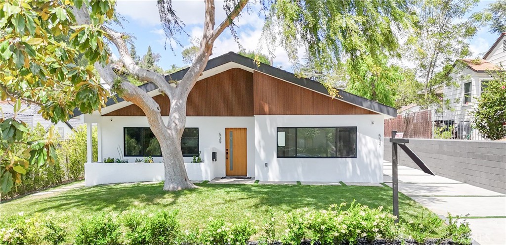Located in the beautiful city of Pasadena situated in the lovely neighborhood of San Rafael Hills, you're welcomed to this exquisitely renovated 3 bedroom and 3 bathroom Front Home with a brand new ADU that features 2 bedrooms and 2 bathrooms. As you enter you are welcomed by an abundance of natural light to highlight the large living room with custom designed porcelain fireplace and large brand new wall mounted 86" LG TV. The dining area and custom kitchen are a sight to see. The stunning kitchen has been designed with modern touches that include quartz countertops, German built cabinets with some having 1 touch open and close technology, brand new Thermador appliances, built-in wine cooler and a large pantry with customizable storage. The spectacular primary bedroom suite has lots of natural light, the beautiful bathroom has tile flooring, shower tub, floating vanity and a spacious walk-in closet. Next to that is the second bedroom suite with a bathroom that also boasts tile flooring, floating vanity, gorgeously tiled shower and a spacious walk-in closet. The spacious third bedroom is located to the rear of the home near the third bathroom. The front home is fitted with a laundry room with a brand new washer and dryer. There is a security room that houses the security camera system that has been installed all around the front unit. The rear ADU is a gorgeous 2 bedroom and 2 bathroom gem. As you enter the large living is perfect for lounging and quick access to the modern kitchen. Living room is fitted with a large wall mounted TV. The primary suite features a bathroom with new tile flooring, floating vanity and shower tub. The spacious second bedroom is located at the end of the hall near the 2nd bathroom. There is also a separate security cameras installed for the ADU and fully paid solar panels. Both homes have new flooring, new paint throughout, recessed lighting, indoor laundry room as well as a new presidential roof. The attached garage is located between both homes. The driveway has been stunningly designed with faux grass accents. Home has been beautifully landscaped with automatic sprinkler system. Come take a look.