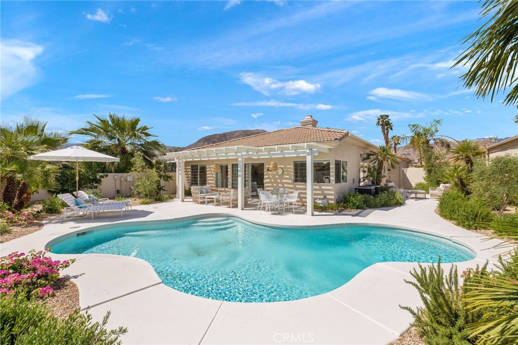 Prepare to be Wowed! Fully furnished, available and equipped. See below for terms.This completely re-imagined home sits on a private corner lot in the sought-after gated community The Estates at Rancho Mirage. No expense was spared when recreating this incredible 3-bedroom, 2-bathroom desert retreat. Offering approximately 2,102 square feet of living space, this home has a great layout and has been completely remodeled. As you enter the front door you will love the open floor plan with 10-foot ceilings and tons of natural light pouring into the Living Room, Dining Room, Family Room and Kitchen. A double-sided fireplace is the show piece of the living space creating just enough separation with a designer's touch. The porcelain tile runs throughout the entire home anchoring the cool color palette. A redesigned kitchen is both stylish & functional with the breakfast bar, wood shelves, quartz surfaces and Thor Professional Stainless-Steel appliances. The primary suite is oversized and has a spa-like bathroom with dual vanities, tiled shower, soaking tub with tiled accent walls, dual vanity and a large walk in closet. There are multiple sliding doors leading out to the newly landscaped yard which wraps around the property providing for multiple outdoor entertaining and enjoyment areas. The freshly remodeled sparkling pool takes advantage of great sunshine while the alumawood patio cover provides wonderful, shaded areas in the backyard oasis with mountain views sweeping around the property and complete privacy. This premiere destination with a most desirable location is just minutes to fine dining, entertainment, Palm Springs Airport, and all the other great desert amenities. The well-maintained community includes beautifully landscaped grounds, walking paths, pools & spas. Come home and start enjoying the desert lifestyle today. Annual lease 3,750.00. Seasonal- July through September 3,750.00 per month. October through May 5,500 to 7,500 monthly.