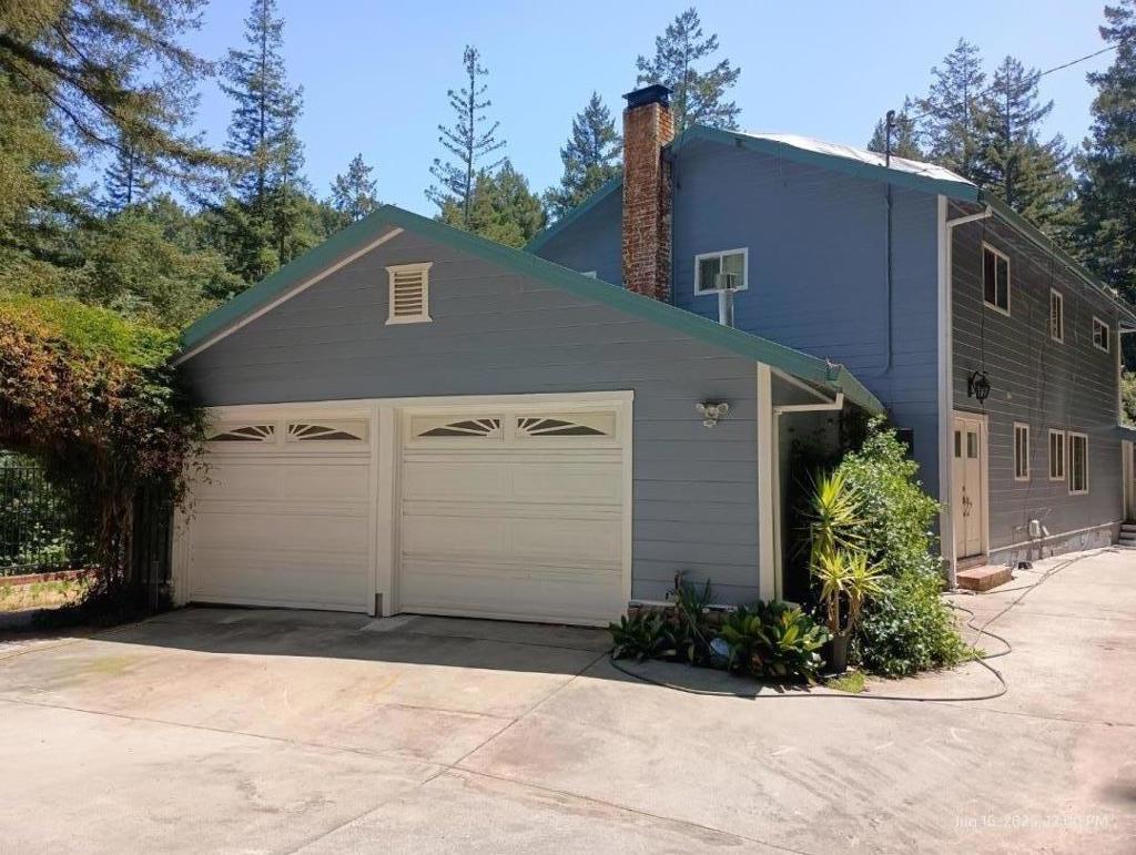 Escape to your own private gated estate in desirable Glenwood Acres. Located in the beautiful Santa Cruz Mountains easy access to Hwy 17. The long private driveway welcomes you to a quiet spacious home. French doors to the game room features a custom oak bar, wood burning stove and double glass doors to the spacious redwood deck with seating all around. The concrete driveway which is the length of the house, goes under the game room to a workshop or you can create your own wine cellar. The interior consists of 4 bedrooms/3 baths. The primary suite has a beautiful view of the redwood trees and the blue sky. The ensuite bathroom consists of oversized bathtub under a large window, huge shower with dual shower heads. A skylight over the tub and one over the shower. Kitchen has granite counters and stainless steel appliances. Laundry room has a shower with marble floor and porcelain tiled walls and ceiling. Foyer has beautiful travertine tile with custom made travertine baseboards. There are 2 garages. Garage in front of the house second garage under the game room. City water, High speed Comcast internet. This property is being sold "As Is".