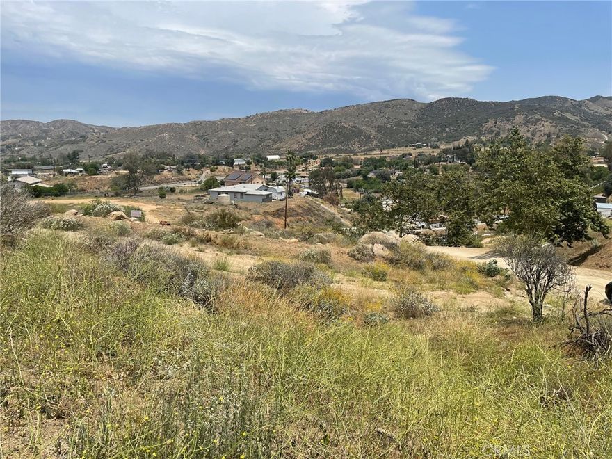 Amazing Views! This prime 1-acre parcel of vacant land offers stunning panoramic vistas and is ready for your vision. A Certificate of Compliance and an environmental study had previously been completed on this property. The property also previously had grading permits approved. Natural gas is already in the street. Electricity is nearby. You will need a well for water. This lot is on an incline, and it needs grading to clear a homesite.  A rare opportunity to build in a well-prepared location! Please contact the County of Riverside and utilities companies to confirm all pertinent information.