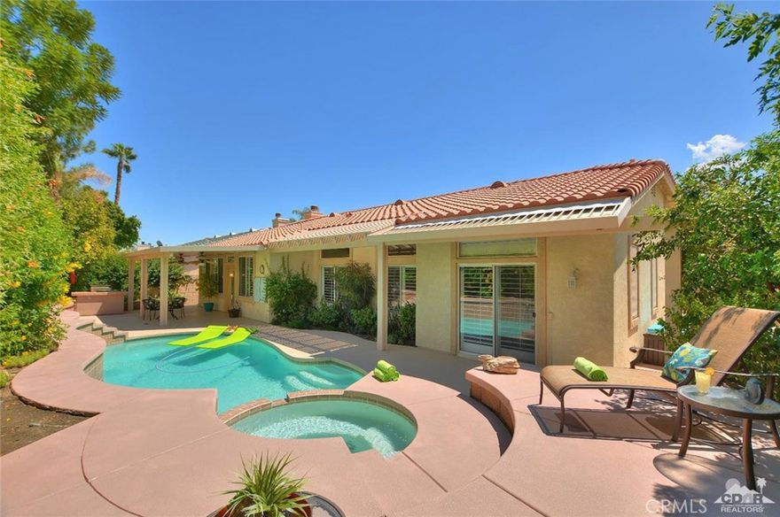 Welcome home to Sonata 2 in beautiful Palm Desert. This spacious, light and bright, 3 bedroom, 3 bath plus den home features dark wood-like floors throughout, plantation shutters, fireplace and custom paint. Your friends and family will be sure to enjoy the open floor plan with plenty of room for entertaining around the salt-water pool and spa. Enjoy grilling dinner under the covered patio and enjoying the sunsets or just relaxing with a good book. The generous sized master bedroom is on the opposite side of the home for privacy for you and your guests and features direct access to the spa. The front yard has been landscaped with drought-resistant desert landscaping. There is also a 3-car garage. This home is perfect as a family home due to the school district, a vacation home or a rental. No HOA dues! Centrally located, Sonata 2 is close to shopping, dining, world-class golf, tennis, hiking, biking and all that the desert has to offer.