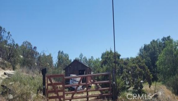 Wanna get away, move to Hemet, CA. This rural home with mountain views, sits on a good size lot of approximately 127,631 sq. ft. Appears the home was built in 1953. Why rent when you can own for less here. If you blink it will be SOLD. Buyers check City, County, Zoning, Tax, and other records to their satisfaction. AS-IS SALE property.
