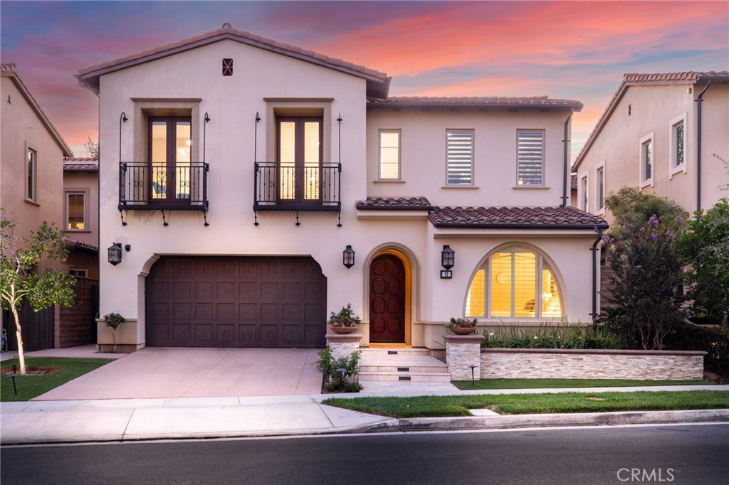 Behind the prestigious gates of The Groves at Orchard Hills, this distinctive residence showcases breathtaking designer finishes that set it apart from every home in its class. Flooded with natural light, the spectacular open layout features soaring ceilings, wrought-iron accents, rich wood flooring, and dramatic beams, creating an inviting space for both luxurious family living and grand entertaining. The chef-inspired kitchen is a true showpiece with sleek white cabinetry, custom countertops, high-caliber stainless appliances, and a large center island overlooking the great room, dining area, and conservatory. Accordion bi-fold doors blur the line between indoors and outdoors, opening to a spacious backyard designed for gatherings and relaxation. The primary suite offers a serene retreat with a spa-like bath and dual walk-in closets, while the generous secondary bedrooms each include en suite baths. A versatile bonus room, upstairs laundry, and an extended main-floor bedroom with private bath ensure functionality and flexibility for modern living. Premium upgrades include Custom window treatments & premier shade system, alarm system & surround sound, Tankless water heater & paid off solar panels, and Built-in EV charger. The backyard oasis is equally impressive, featuring California room, an open artificial grass play area with mini golf green, a wood-paved entertainment space, and a natural stone wall fountain for tranquil ambiance. This turn-key home is complemented by Orchard Hills’ world-class amenities: multiple pools, a clubhouse, parks, hiking trails, basketball and tennis courts, and proximity to award-winning schools and the vibrant Orchard Hills Shopping Center. Don’t miss this rare opportunity to enjoy resort-style living in one of Irvine’s most prestigious neighborhoods!