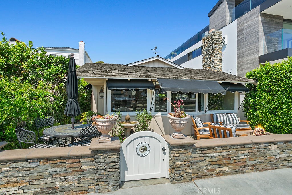 BALBOA ISLAND WATERFRONT – WINTER RENTAL - PRIME GRAND CANAL LOCATION | Experience the quintessential Balboa Island lifestyle in this beautifully remodeled single-level waterfront home, perfectly situated along the coveted 200 block of the Grand Canal and Boardwalk. This turnkey residence offers 3 bedrooms, 2 bathrooms, and an inviting open-concept layout with vaulted ceilings. This beautiful cottage includes air conditioning, plus distressed dark walnut plank flooring. The spacious living room features a honed black granite fireplace, while the gourmet kitchen boasts a built-in refrigerator, DCS stainless steel range, Bosch dishwasher, granite countertops, and custom cabinetry. Enjoy parking convenience with a 2-car attached garage plus an additional rear parking space. Step outside to the expansive, beautifully landscaped front patio with flagstone and ledger stone hardscape, a tranquil water fountain, and a cozy gas fire pit—perfect for waterfront entertaining. This home comes fully furnished and includes a golf cart, bicycles, kayaks, and a stand-up paddle board, making it effortless to enjoy everything Balboa Island has to offer. Available as a “Winter Lease” only from September 15, 2025 to May 31, 2026.