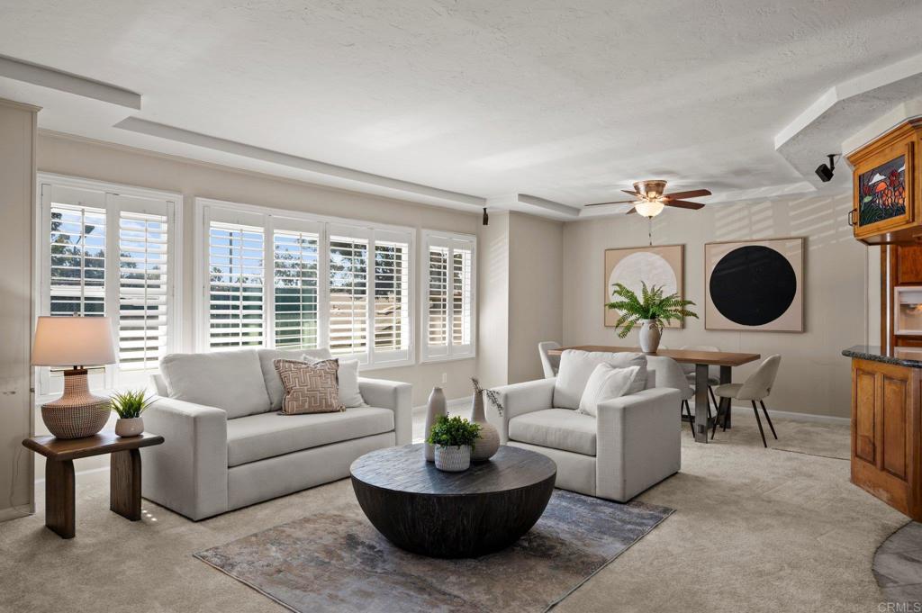 Spacious Upper-Level Condo with Rare Private Patio & Mountain Views in La Mesa! One of the largest floor plans in the complex—this oversized 2-bedroom, 2-bath upper unit offers 1,200 sq. ft. of comfortable, open concept living that is unlike most condos! One of only two units with a private exterior upstairs patio & perfectly positioned to capture mountain views off the back! Inside, enjoy newer carpet, plantation shutters, dual pane windows, central heating & air. The open layout features a massive en-suite primary bedroom, a spacious second bedroom with direct patio access, and a light-filled living area ideal for both relaxing and entertaining. The community’s amenities include a pool, spa, and tennis courts, with HOA dues covering hot water, sewer, and trash for added value. Conveniently located near shopping, dining, and with unbeatable access to the 8 freeway, this home blends tranquility with accessibility. Don’t miss this rare opportunity to own a unique upper-level unit in one of La Mesa’s most desirable locations!