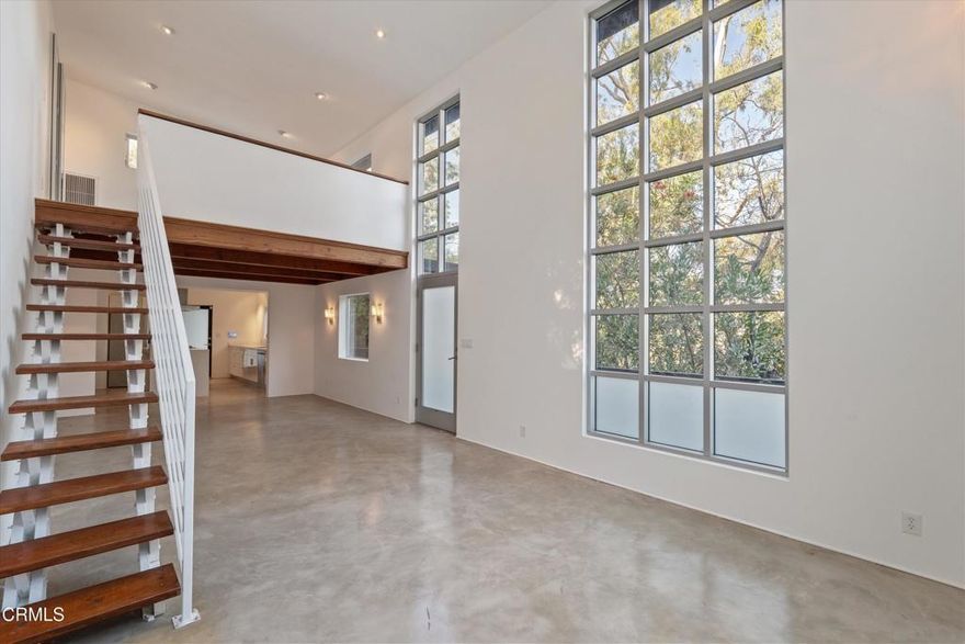 Experience the perfect blend of serenity and modern style at 4520 San Andreas Ave. Perched in the lush hills of Mount Washington within the coveted Mt Washington school district, this stunning modern residence offers 2 bedrooms and 1 bathroom with polished concrete floors throughout. Enjoy a bright and airy floor plan with an abundance of windows that flood the space with natural light. The updated kitchen includes quartz countertops, stainless steel appliances, and flows effortlessly into the dining and living areas, making it perfect for hosting. The home includes a loft-style second bedroom ideal for a creative studio or home office. The outdoors offers a variety of private areas for al fresco dining or a quiet morning coffee amidst the greenery. Accessed via a long, private driveway that leads you away from the street, this home offers a rare sense of seclusion above the city. Whether you're exploring local trails, frequenting neighborhood favorites, this home represents the pinnacle of contemporary urban living.