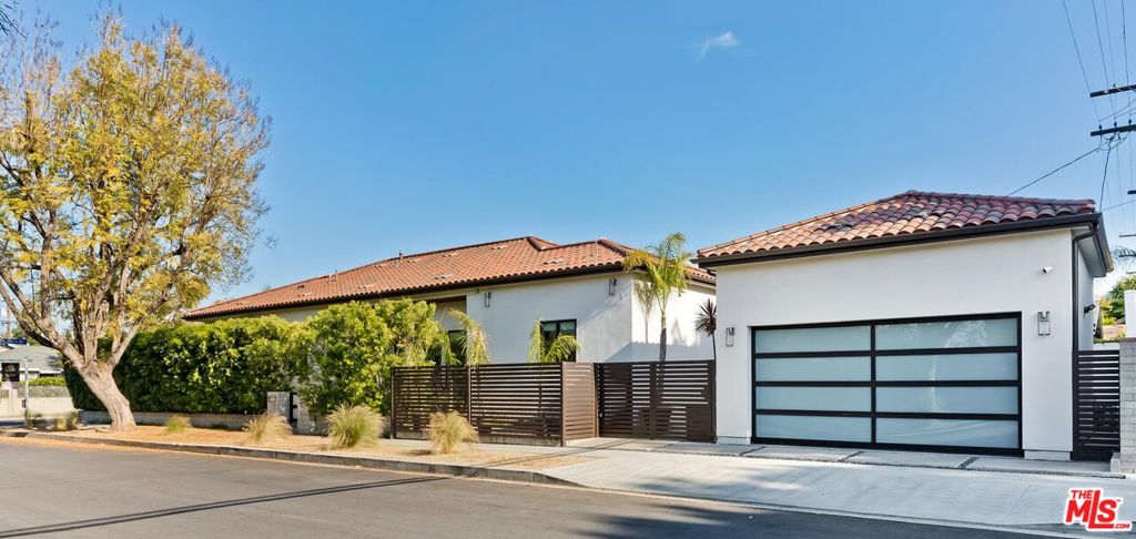 Welcome to a fully renovated Modern masterpiece situated south of the Blvd in the heart of Encino. Private and gated smart home boasts an open-concept floor plan with soaring 12-foot ceilings, white oak floors, a glass-enclosed fireplace, Venetian plaster accent walls, & recessed lighting throughout. A gourmet chef's kitchen with Euro quartz countertops, a grand island with bar seating, custom wood cabinetry, Viking appliances, two dishwashers, two sinks, a wine refrigerator, built-in microwave, pot-filler, and an 8 burner stove with dual ovens. This smart home features Control4 and Nest systems that control lighting, temperature, music, television, security cameras, doorbell, and a video intercom system. Master bedroom ensuite with a large walk-in-closet, custom light fixtures, a venetian plaster accent wall, an elegant dual sink vanity and separate makeup vanity master bath, and with access to an enclosed grass play yard. All bathrooms are en-suite, equipped with the finest fixtures and finishes, including quartz countertops, Toto toilets, Kohler sinks, Grohe fixtures and designer ceramic tile. Fully retractable glass doors that open to an entertainer's backyard with a sparkling heated pool, jacuzzi and BBQ grill with hosting areas which are perfect for lounging or entertaining alike. This home also features a 2-car detached garage, closets in every bedroom with built-in shelving, a remote-controlled drop-down shade in the backyard, and a water filtration system that runs throughout the house. Also available fully furnished short term for an additional cost.