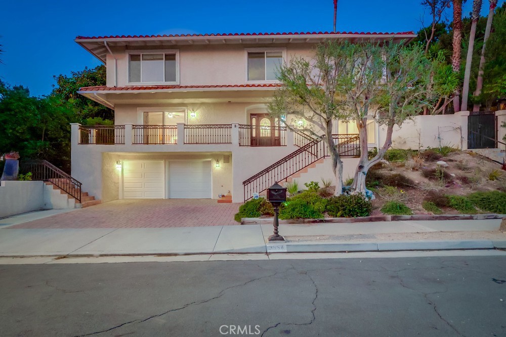 Tucked at the end of a quiet cul-de-sac, this well-maintained RPV home offers thoughtful design, quality finishes, & multiple indoor-outdoor living spaces—with ocean views from nearly every room.
Step into the main level through a beautiful wooden front door, set w/ decorative glass, into a home where everyday living and entertaining flow effortlessly. The living room features 10-ft ceilings, crown molding, recessed lighting, & a gas fireplace w/ a classic mantle. Natural light fills the space through oversized sliding glass doors, connecting you to the outdoors at every turn.
The kitchen is equipped w/ deep brown wood cabinetry, Viking 6-burner range w/ matching hood, & space for a full dining table. From here, you can step directly onto a large, south-facing deck w/ ocean breezes & peek-a-boo views—an ideal spot for coffee, outdoor-dining, or just taking in the sun. Just behind the kitchen, a private back patio receives gentle, indirect sunlight throughout the day—perfect for planters. Off to the side, a secluded deck framed by tall hedges offers complete privacy & shade—a great space to read, work, or relax.
A half bath w/ pedestal sink finish off the main floor, keeping all social and entertaining functions on one level.
Upstairs, all four bedrooms feature ocean views. The spacious primary suite includes brand-new carpet, large south/east-facing windows, a walk-in closet, & an updated stone shower. Three additional bedrooms offer generous closet space, a mix of new carpet & laminate flooring, & large windows that draw in natural light. A remodeled hallway bathroom w/ quartz counters, tile shower, & wood cabinetry. Centrally located, w/ a linen storage shelf just outside the door.
Outside, the large side yard is a standout feature—topped w/ a pergola, surrounded by tall trees, & elevated just enough to catch ocean views. There’s plenty of space here to create your own private retreat.
Downstairs, the two-car garage includes a utility sink, a dedicated storage room, & additional driveway parking.
While the home offers privacy & seclusion, it’s also conveniently located near Trump National Golf Course, scenic hiking trails, Golden Cove Shopping Center, Point Vicente Lighthouse, & some of the most breathtaking coastline in Southern California.
And just in time for the new school year, you'll be in the highly sought-after Palos Verdes Unified School District—one of the top-rated districts in the state.
**Addl Screening Criteria Required**