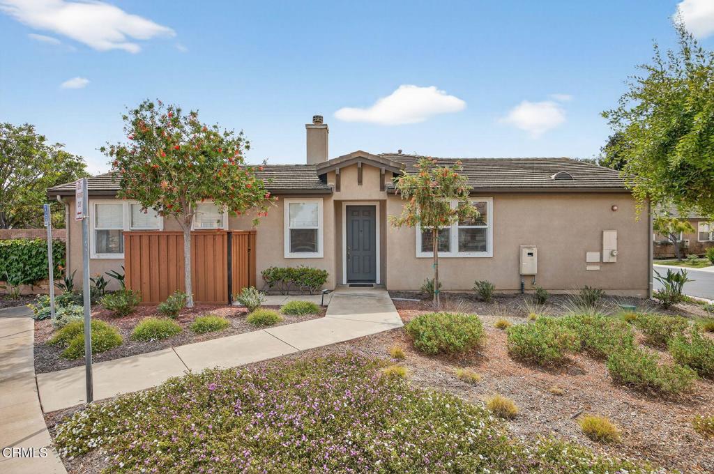Nestled on a prime corner location within the highly sought-after gated 55+ community of Pacific Pointe, this beautifully maintained 2-bedroom, 2-bathroom condominium offers the perfect balance of comfort, style, and convenience. At 1,324 sq. ft., this single-story home is a charming retreat, thoughtfully designed with an open layout and a wealth of desirable features. As you enter, you're greeted by a spacious living room featuring a cozy fireplace, ideal for relaxation and entertainment. The adjacent dining area flows seamlessly into the kitchen, which boasts plenty of cabinets and counter space, perfect for preparing meals and staying organized. The primary en suite is spacious and complete with sliding doors to the rear yard, ready to create an indoor-outdoor living experience perfect for peace and tranquility. The second bedroom and bathroom are equally well-appointed, offering comfort and convenience for guests or family. The additional den/office space offers flexibility for your lifestyle needs, whether for work or leisure. For added comfort and ease, this home features an attached 2-car garage, providing both security and convenience. The corner location adds ease of access to guest parking, making it even more convenient when hosting visitors. The community itself is immaculately maintained, with a designated community area perfect for relaxing, socializing, or grilling with friends and neighbors. Whether you're enjoying the quiet solitude of grilling or gardening in your own private backyard or taking advantage of the communal amenities, this home offers a lifestyle of comfort and ease.
