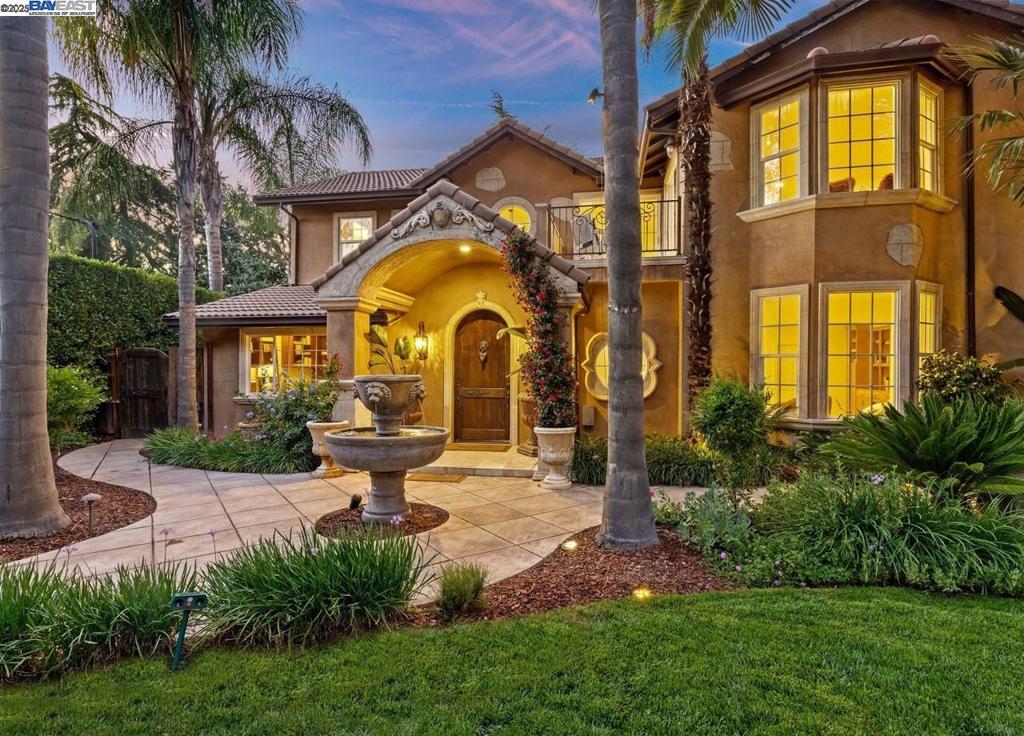 A rare corner-lot estate offering what most homes in Danville can’t—space to create exactly what you need. With a custom beach-entry rock pool, grotto, and sports court already in place, this expansive 16,988 square foot lot still offers room to build. City provided ADU designs plans available, making it easier to add flexible living space, expand garage capacity, or explore potential SB9 lot split opportunities (Buyer to verify). In a market where space is limited, this property delivers the versatility today’s Buyers crave. Inside, the home blends timeless architecture with modern comfort: formal dining, spacious living areas, and a chef’s kitchen designed for gatherings. The au pair suite with private entrance, kitchenette, and full bath offers flexibility as a 5th bedroom, home office, or guest quarters. Upstairs, the primary suite is a true retreat with a private balcony overlooking the resort-style backyard, spa-inspired bath, and dual walk-in closets. A junior suite with Tuscan balcony, plus two additional bedrooms and a full bath, complete the upper level. Located near award-winning schools and town, this is a signature opportunity to create the dream property you’ve been waiting for.
