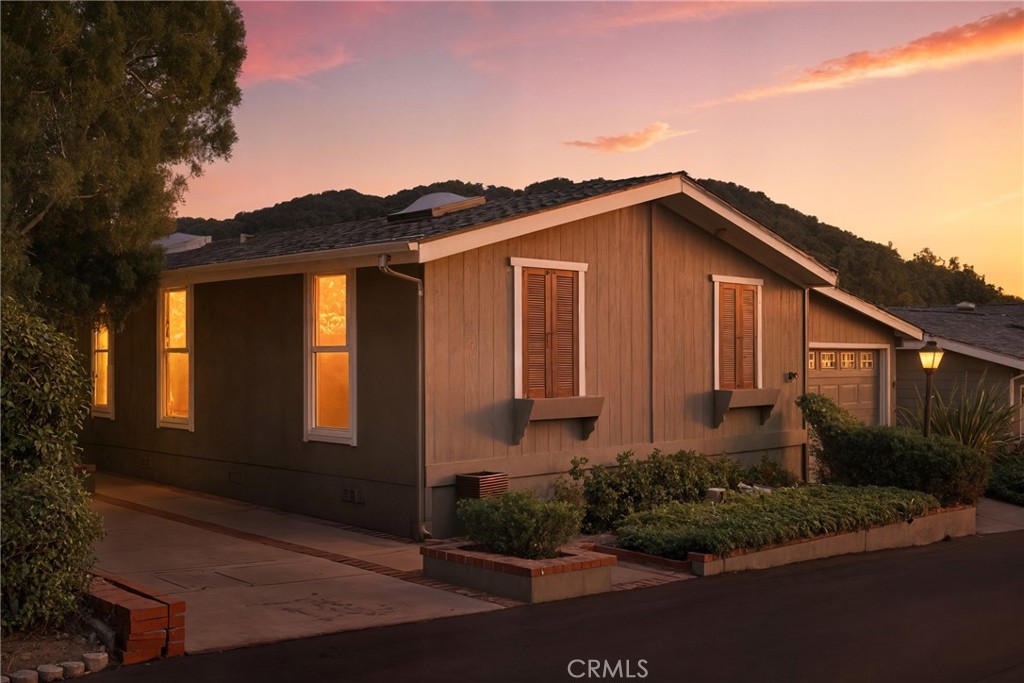 Welcome to this beautifully maintained, light-filled 2-bedroom, 2-bathroom home offering 1,504 sqft of thoughtfully designed living space. Located in Indian Hill, a 55+ community situated within the private, gated enclave of San Luis Bay Estates, this home combines comfort, privacy, and a vibrant lifestyle in one of the area's most desirable settings. Step inside and enjoy the warm ambiance of natural light streaming through two skylights and expansive floor-to-ceiling windows that frame breathtaking views from the living room, dining area, and kitchen. With two spacious living areas, there's plenty of room for relaxing or entertaining guests. Just off the kitchen is a convenient and private office nook—perfect for working from home, managing daily tasks, or pursuing hobbies. The generous primary suite is a true retreat, featuring a roomy layout and a large private bathroom complete with dual vanities, a soaking tub, a separate shower, and ample counter space. Additional highlights include an enclosed carport with an automatic garage door, two dedicated parking spaces, a laundry closet, and central air with forced heating for year-round comfort. Step out onto the back deck with a comfortable seating area—ideal for enjoying meals with friends or soaking up the peaceful surroundings. Located directly across the street from a tranquil park and convenient guest parking, this home also offers access to a fantastic community clubhouse with a pool, spa, social gathering space, and a putting green for active leisure. Enjoy the unbeatable location just minutes from the heart of Avila Beach, where opportunities for recreation and relaxation abound. Spend your days exploring the Bob Jones Trail, relaxing at Sycamore Mineral Springs, shopping at Avila Valley Barn, or working out at the Avila Bay Athletic Club. You'll also find local golf courses, live music venues, and seasonal events just a stone’s throw away. This area is surrounded by charming apple farms and award-winning wineries, offering plenty of ways to enjoy the Central Coast lifestyle. And with San Luis Obispo and Pismo Beach just a short drive away, you’ll have even more dining, shopping, and entertainment options within easy reach. Don’t miss this opportunity to enjoy comfort, convenience, and vibrant community living all in one place! All information is deemed reliable but not guaranteed. Buyer and Buyer's Agent to verify all information and do their own due diligence prior to the close of escrow.