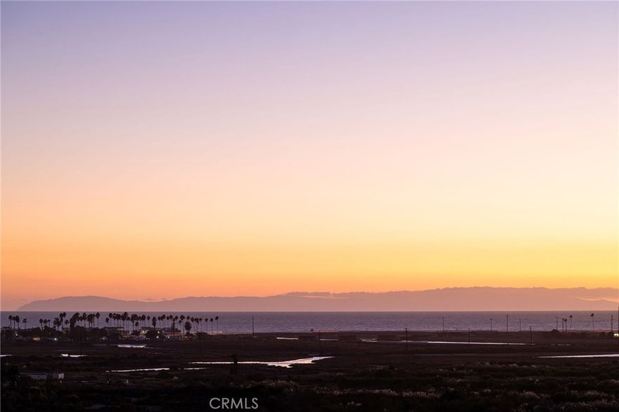 Commanding panoramic, unobstructed views of Catalina Island, this reimagined modern coastal estate is a rare offering within a private gated community for Costa Mesa. Fully rebuilt and expanded for an end user with no expense spared, the home blends refined design with timeless architecture and absolute privacy. Set on a premier lot with no visible neighbors, the residence captures sweeping ocean views from nearly every room. The interiors showcase high-end finishes and craftsmanship throughout, including Dornbracht and Vola fixtures, Lutron smart lighting, and dual-zone HVAC systems. The property includes a fully integrated ADU, ideal for guests, staff, or multigenerational living. Outdoor spaces are designed for elevated entertaining with a 12' custom Hestan kitchen featuring a 42” grill, refrigeration, and kegerator, along with dedicated space for a spa and fire features. Additional highlights include a 400-amp electrical panel (future-ready for EVs and spa), two tankless water heaters, and all-new electrical, plumbing, and mechanical systems. In close proximity to world class beaches, shopping and dining.