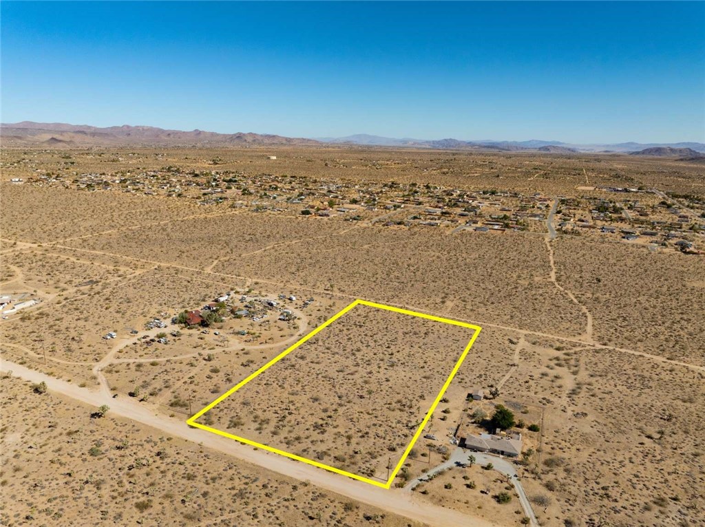 Primary Structure and 3 additional structures are allowed. 5 Acre Land in a well established neighborhood of Yucca Valley. Primary structure and three accessory homes are allowed. Financing is available. Lots of space to put your Toys. No HOA. Water line is on the street to connect.