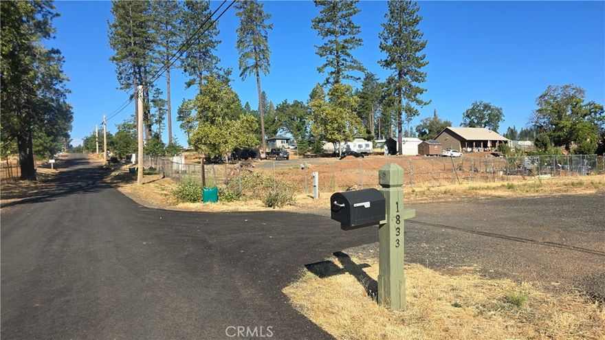 YEAR-ROUND CREEK, SHADY & GREEN WITH MATURE TREES on this beautiful 1-acre parcel! This lovely level lot already has water and septic connections, along with a temporary power pole from previous RV hookups, making it easy to get started with your plans. Two secure storage sheds (12x16 and 12x10) offer plenty of lockable space for tools, toys, or seasonal items, while fruit trees and garden areas add even more charm and usability. Set back off the main road on a private lane, this property provides peace, privacy, and accessibility, all while being just a block from the elementary school and minutes from downtown Paradise, shopping, dining, schools, and parks. The Rural Residential zoning is a rare find and offers flexibility for your vision, whether you’d like to keep small or large farm animals—from chickens to horses—or simply enjoy the privacy and space for your new home. You’ll love the sunrise views to the east over Concow Ridge, the shaded creek that runs through the property, and the overall peaceful atmosphere. Recreation opportunities are abundant and close by, with Lime Saddle Marina at Lake Oroville’s north end just 7.5 miles south, where you can enjoy boating, water skiing, swimming, and fishing. Paradise Lake is only 9 miles north, a tranquil retreat for kayaking, canoeing, fishing, and wildlife watching in a no-motorboat zone. For even more outdoor adventure, explore the West Branch of the Feather River nearby, offering swimming holes, nature trails, and even a little gold panning! Conveniently located near schools, the post office, and shopping, this property truly has the best of both worlds: peaceful seclusion and everyday convenience. Whether you’re an outdoor enthusiast, hobby farmer, or simply someone seeking a serene setting to build your future, this is an opportunity you won’t want to miss!