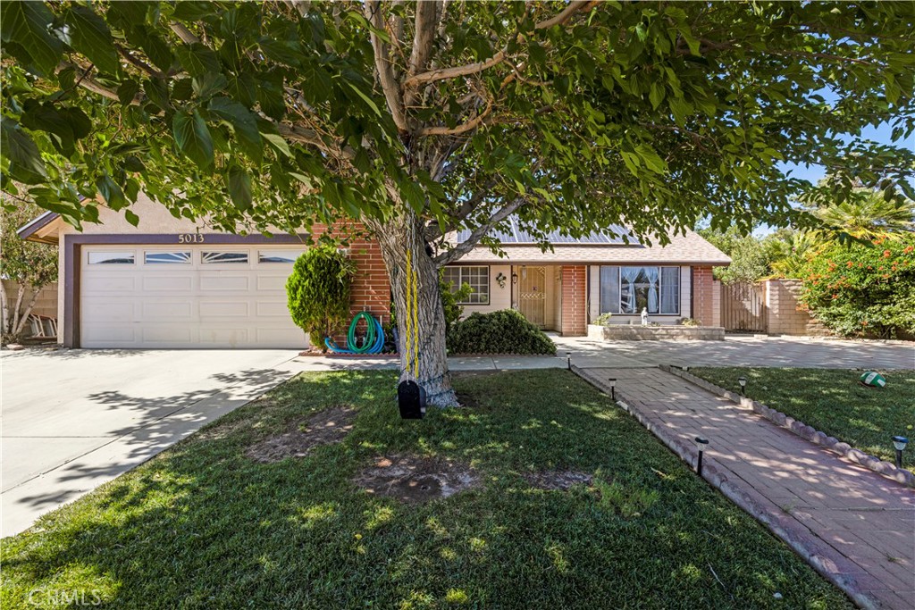 Charming 3-Bedroom, 2-Bath Home in Desirable East Palmdale, this standard sale home features three spacious bedrooms and two bathrooms, located in a well-established neighborhood of East Palmdale. The interior offers tile flooring throughout and generously sized bedrooms. The property is surrounded by mature trees and a fully enclosed yard with a combination of masonry and wrought iron fencing for added privacy. Additional highlights include a newer roof and a fully paid-off solar system—both included in the sale.