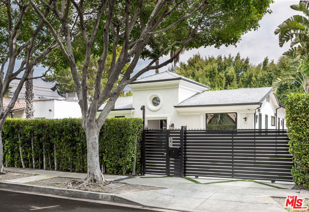Set behind a private gate, this completely remodeled contemporary home is located in the most exclusive area of West Hollywood. This trophy property features an open floor plan perfect for indoor-outdoor entertaining with a designer kitchen, skylights and hardwood floors throughout. Formal living and dining room flow seamlessly to opening onto a private entertainer's backyard with outdoor BBQ, lounge area, fire-pit and hot tub. Master suite is complete with 2 walk-in closets and steam shower. Opportunity to own a rare 6000+ lot in the heart of West Hollywood, on one of the most beautiful tree-lined streets in the neighborhood.Hide