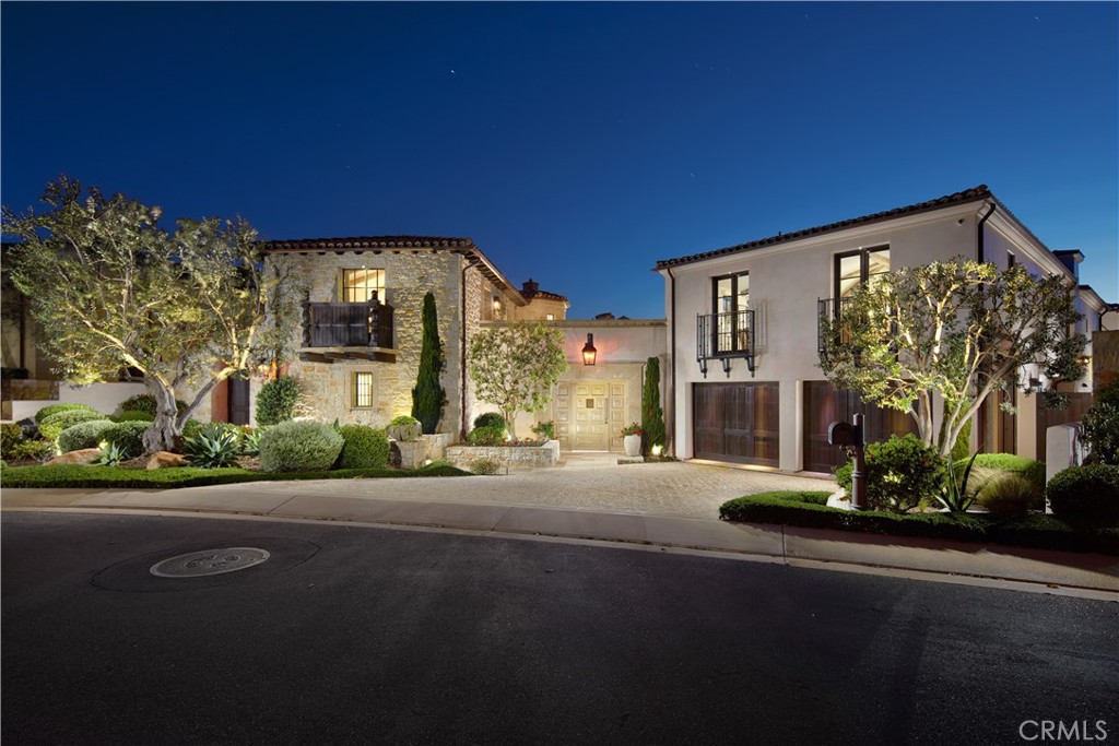 Inspired by California’s iconic coastal towns—from La Jolla to Santa Barbara—17 Pacific Ridge Place was designed to embody timeless architecture rooted in European influences from Italy, France, and Spain. Rather than follow passing trends, the vision drew from architectural traditions with lasting resonance—resulting in a refined interpretation of California living. A tribute to coastal life, the estate blends the rarified ambiance of a private resort with comfort—set within The Strand at Headlands, Dana Point’s most coveted guard-gated beachfront community. Completed in 2017, this incomparable residence stuns with breathtaking whitewater views of the Pacific Ocean, dramatic coastline, sunsets, and Palos Verdes. Tucked along a quiet cul-de-sac, the home exudes stately elegance while keeping its many features discreetly out of view—creating a haven of private, comfortable living. Approximately 6,272 square feet, the residence features four en suite bedrooms and five-and-one-half baths, including a two-story guest house that makes it possible to enjoy two distinct one-bedroom suites, or one complete two-bedroom, two-bath hideaway joined by a staircase within its turret. A gallery-style entrance leads to the main home’s living spaces, including a great room that opens to the central courtyard and an ocean-view loggia, and a dining room that flows to the courtyard through an entire wall of fold-away glass doors. The ocean-view kitchen displays an island, nook, secondary catering kitchen, and top-of-the-line Sub-Zero, Wolf and Bosch appliances. Homeowners will appreciate the opulence of a main-level primary suite that overlooks the ocean, opens to the backyard, and showcases a freestanding tub and walk-in closet. Separate staircases lead to an ocean-view office or studio, and a massive media room with walk-in wet bar, bridge access to the casita, and a 110" screen with 4K projector. Nearly 14,700 square feet, the estate’s grounds enhance entertaining in a private central courtyard, and a backyard with covered loggia, outdoor kitchen and oversized spa. Residents here enjoy 24-hour guarded-gates, security patrol, and a 9,000-square foot beach club that Strand homeowners own exclusively. The private community borders the Dana Point Preserve, Harbor Point Conservation Park, and Hilltop Conservation Park for 70 acres of parks and picturesque trails.