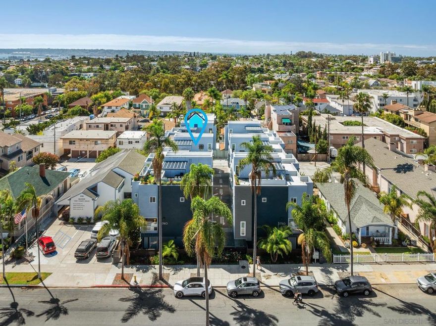 Urban Elegance in the Heart of Hillcrest!! Experience elevated city living in this sophisticated townhome, ideally located in the vibrant heart of Hillcrest with LOW HOA! Featuring a spacious open floor plan, soaring cathedral ceilings, and an abundance of natural light, this home blends modern upgrades with timeless style. Enjoy brand-new flooring throughout, fresh designer paint, and updated lighting that enhances every room. The gourmet kitchen is a chef’s dream, boasting stainless steel appliances, a walk-in pantry, and a peninsula with bar seating—perfect for casual dining or entertaining. The kitchen flows seamlessly into the expansive great room, where a cozy fireplace and oversized windows create an inviting space to relax or host guests. Upstairs, you’ll find two generously sized bedrooms, each with its own ensuite bathroom, plus an optional third bedroom or home office—ideal for today’s flexible lifestyle. Step outside to your private terrace and take in breathtaking ocean views and sparkling city lights—an exceptional setting for entertaining or unwinding. Located just steps from San Diego’s best restaurants, boutiques, and parks, this townhome offers the perfect balance of luxury, comfort, and convenience in one of the city's most walkable neighborhoods.