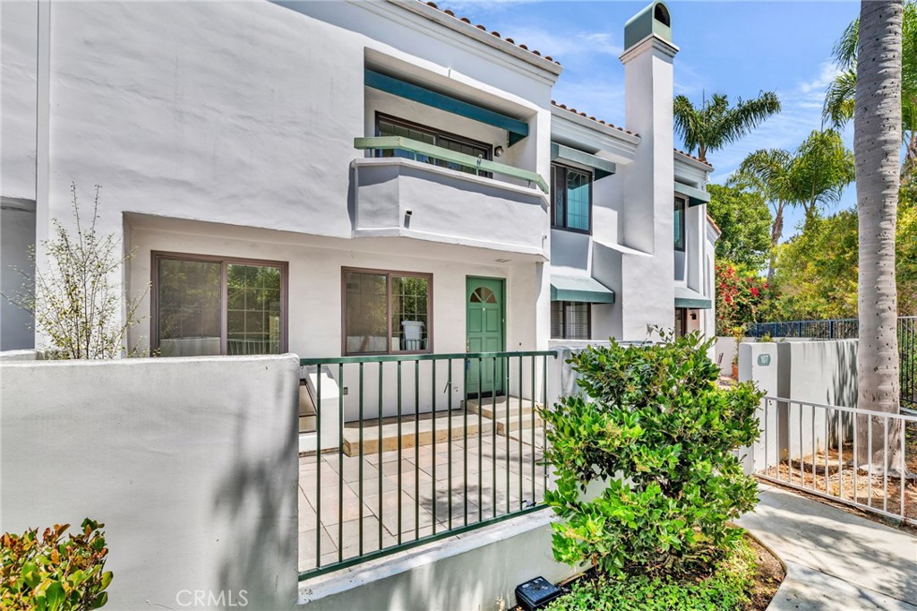 Located in the gorgeous, guard gated community of Pacific Ranch a highly sought after 24 hour guard gated community.This multi level Townhouse includes an expansive living room that welcomes you with soaring ceilings, a cozy fireplace, and abundant natural light, creating a perfect setting for relaxing or entertaining. The formal dining area effortlessly flows into a kitchen equipped with generous counter space, custom cabinetry, and all the conveniences you desire. Step outside onto two private outdoor patios—ideal for al fresco dining, relaxing mornings, or evening gatherings. Just a short two-mile drive from pristine beaches and the sparkling Pacific Ocean, this prime location invites you to indulge in sun, surf, and seaside adventures. Whether lounging on the sands or cruising down the iconic Pacific Coast Highway toward Newport Beach and Balboa Island, your coastal lifestyle awaits. Pacific Ranch offers resort-style amenities including three recreation centers featuring sparkling pools and soothing spas, lush landscapes with tranquil ponds, streams, waterfalls, and abundant greenery. Spanning over 40 acres, this vibrant community provides a perfect blend of natural beauty, recreation, and privacy. Enjoy effortless access to boutique shopping, gourmet dining, parks, top-rated schools, and picturesque biking trails—an ideal setting for families, professionals, and retirees alike. Seize this exceptional opportunity to own a piece of paradise in one of Southern California’s most coveted communities. Embrace the coastal lifestyle with peace of mind, security, and all the comforts you deserve. Your dream home in Pacific Ranch awaits! Recent upgrades include luxurious new flooring and fresh paint throughout, enhancing the home's appeal. An attached two-car garage adds convenience to your busy lifestyle.