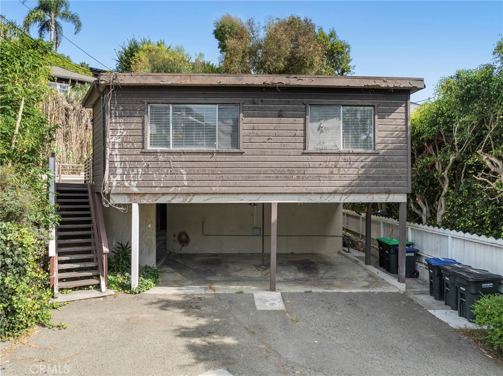 Prime Investment Opportunity in Laguna Beach Village – Duplex with Bonus Unit Located in Laguna Beach Village, this rare duplex property is brimming with potential and perfectly positioned just a short stroll from Laguna Beach High School, world-famous beaches, galleries, dining, and charming local shops. Situated on a quiet, tree-lined street in one of the most walkable and desirable neighborhoods in Laguna, this is a true opportunity for investors, developers, or owner-users with vision.
The property includes two legal units:
Unit A (Vacant): A 2-bedroom, 1-bath unit, ready for renovation and personal customization.
Unit B (Occupied): A 1-bedroom, 1-bath unit, with character-rich details and a long-term tenant in place.
There is also a third, non-permitted bonus unit currently vacant — ideal for future conversion to an ADU or legal third unit (buyer to verify with city). This additional space presents an excellent opportunity to expand the property’s income potential or accommodate multi-generational living.
While the structure is in need of updates and repairs, the location and layout offer strong upside potential for those looking to add value in a premium coastal market. This is a fixer-upper with incredible potential in one of Southern California’s most iconic seaside communities. Whether you’re investing, developing, or creating your own coastal getaway, the possibilities here are wide open. Please Do Not go on the property without an appointment.