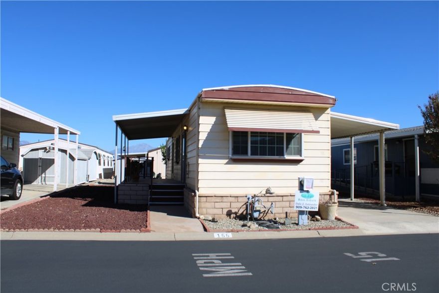 This is a single wide coach, great for a single person. has a large bedroom, the bathroom has a tub plus a stand up separate shower. The living room is across the front of the coach. The kitchen is in the middle with the stove and refrigerator to remain with the coach.

There is a full length carport awning with a shed at the rear. There is a nice front porch for coffee in the morning with a second shed. the roof is six months old and there is central air conditioning.