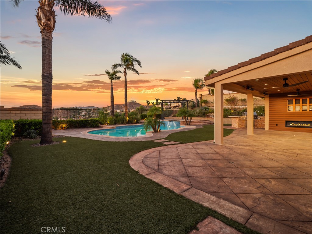 Picture-Perfect Recently Remodeled Stone Crest Home with Breathtaking Views, 4-beds, 3-baths with multiple lofts, a full bedroom and bathroom downstairs, a 3-car garage, and true RV parking! Ideal for guests or multi-generational living, the downstairs suite provides privacy and convenience. The formal living and dining room feature soaring ceilings, picture windows, and abundant natural light. The beautifully updated eat-in kitchen showcases freshly upgraded cabinetry, brand-new quartz countertops, a dramatic full backsplash, and a striking waterfall island. Stainless steel appliances and a large walk-in pantry with built-in shelving complete the space—all with stunning views. The kitchen opens to the cozy family room with a fireplace, perfect for relaxing evenings. Upstairs, you’ll find an office space with built-ins and a spacious loft retreat with multiple views in all directions. The private and HUGE primary suite features serene views, retreat area, a luxurious ensuite bath with a soaking tub, glass-enclosed shower, dual sinks, and a large walk-in closet with custom organizers. Two additional bedrooms and a renovated full bath complete the upper level. Designer upgrades include fresh interior paint on walls, doors, and trim, all new matching electrical fixtures, upgraded flooring and lighting, crown molding, and dual newer HVAC systems. Step outside to your entertainer’s paradise—an incredible backyard with a re-plastered pool and spa featuring a Baja shelf, outdoor shower, gazebo, built-in BBQ with sink and beverage fridge, large turf area, and recently customized covered patio with built-in heaters, fireplace, and custom wood TV wall. Enjoy ambient lighting, low-maintenance landscaping, and spectacular panoramic views! The 3-car garage is finished with epoxy floors, workbenches, cabinetry, 220/240-volt outlet for EV charging, keypad entry, and ADT camera system. Huge gated RV parking, extended driveway, and ample street parking make this home truly unique. No Mello-Roos and located near parks, new shopping centers, and one stoplight to the 14 Freeway. Your dream home awaits, don’t miss this incredible opportunity.