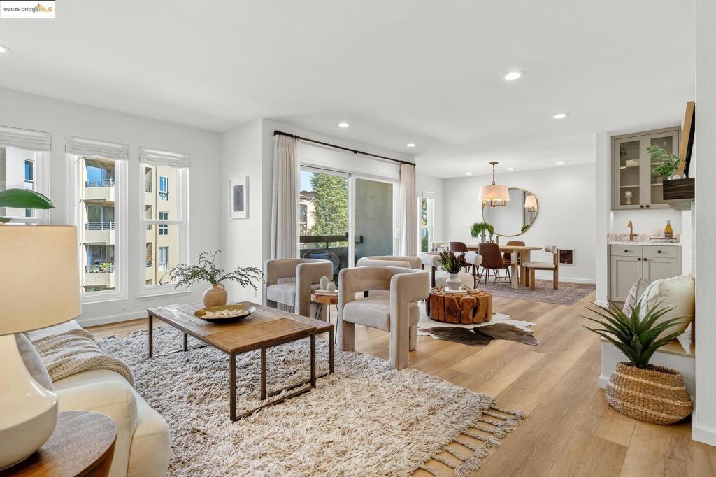 Chic condo living in coveted Upper Rockridge boutique building. This top floor unit is light-filled, open, and beautifully updated. Highlights include an eat-in kitchen, wood burning fireplace, wet bar with new cabinet and marble top, west-facing balcony with peek of the bay view, sleek bathrooms, and custom California closet fittings in the primary suite. Close to College Ave restaurants and shops, BART, AC Transit, Village Market and Claremont Country Club. Easy living awaits!