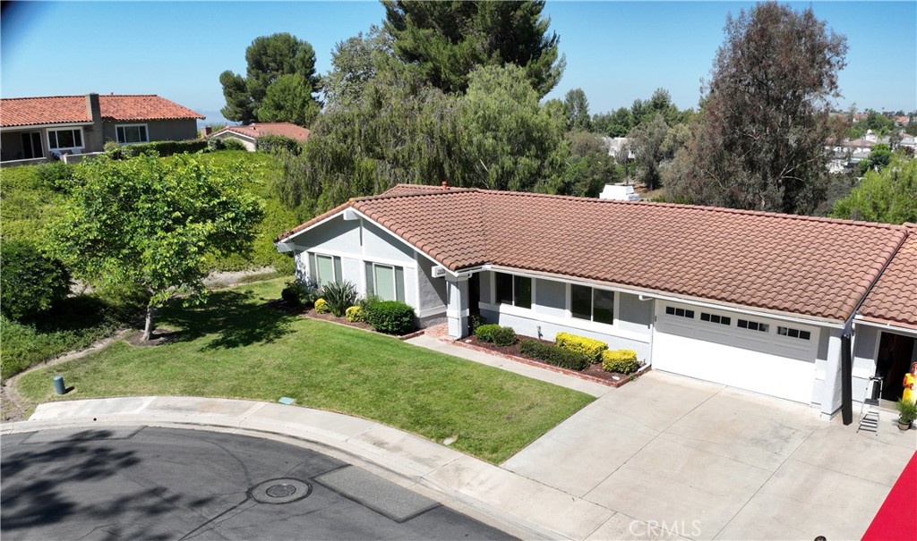 Location is extremely important and I challenge you to find a better location in all of Casta del Sol. Conveniently located close to the Alicia Parkway gate for quick in and out, but with ultimate privacy, view, and plenty of parking for your celebration parties. It's the last house on a cul-de-sac with no houses directly across the street. Check out the photos showing a very private backyard which overlooks the Oso Creek Golf Course, a pond and lots of trees and singing birds. It feels more like a resort than just another house in Mission Viejo. I understand the neighbors on via Murillo are very warm and friendly and often socialize and celebrate life together.
The residence features a great room with vaulted ceilings. The remodeled kitchen is adjacent and open to the great room which has both living and dining areas. The kitchen is equipped with lots of beautiful premium wood cabinets, plenty of counter space and an island with breakfast counter capabilities. This home has 3 bedrooms, 2 baths, 2 car garage and a lockable storage area off the rear patio. The master bedroom, kitchen and living/family room all have views of the backyard. Kitchen and bathrooms have granite countertops. Refrigerator, washer and dryer are included in the purchase.