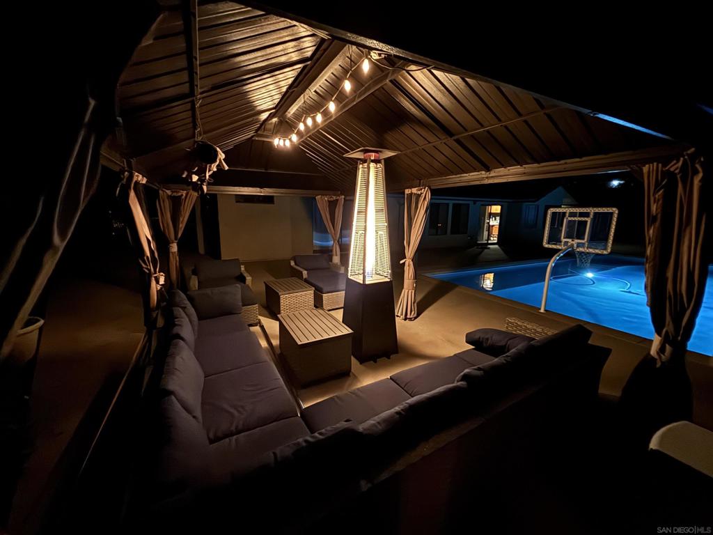 Welcome to your ultimate Alpine retreat! Situated on an expansive lot, this unique property offers a swimming pool, large outdoor area perfect for backyard BBQs also plumbed and wired for a jacuzzi or outdoor kitchen. A private batting cage (with pitching machine), a custom bike track, and a chicken coop for farm-fresh eggs are just a few of the extras! Perfect for entertaining or relaxing, the outdoor space also features a separate shed for multiple uses--office, TV room, private hang out with electrical and wifi. The property also features RV parking with septic hookups, carport, and a spacious 3-car garage with a workshop feel and plenty of storage space. With two large living areas there is plenty of interior space also!