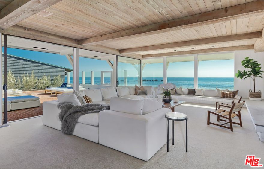 Welcome to 114 Malibu Colony. This iconic mid-century coastal home is located inside the exclusive guard-gated community of Malibu Colony. The main house offers approximately 55 feet of pristine beach frontage. The classic tea house jets out to the naturally formed sand bar which offers a strong connection with the infinite Pacific Ocean. A lavish beach side patio off the tea house is perfect for entertaining and soaking up the California sun. Wake up in the generously sized master suite with whitewater views of the queen's necklace, Catalina island, and beyond. The detached spacious guest house includes a kitchen and extra privacy from the main house. A rare opportunity to own a property of this magnitude behind the gates.
