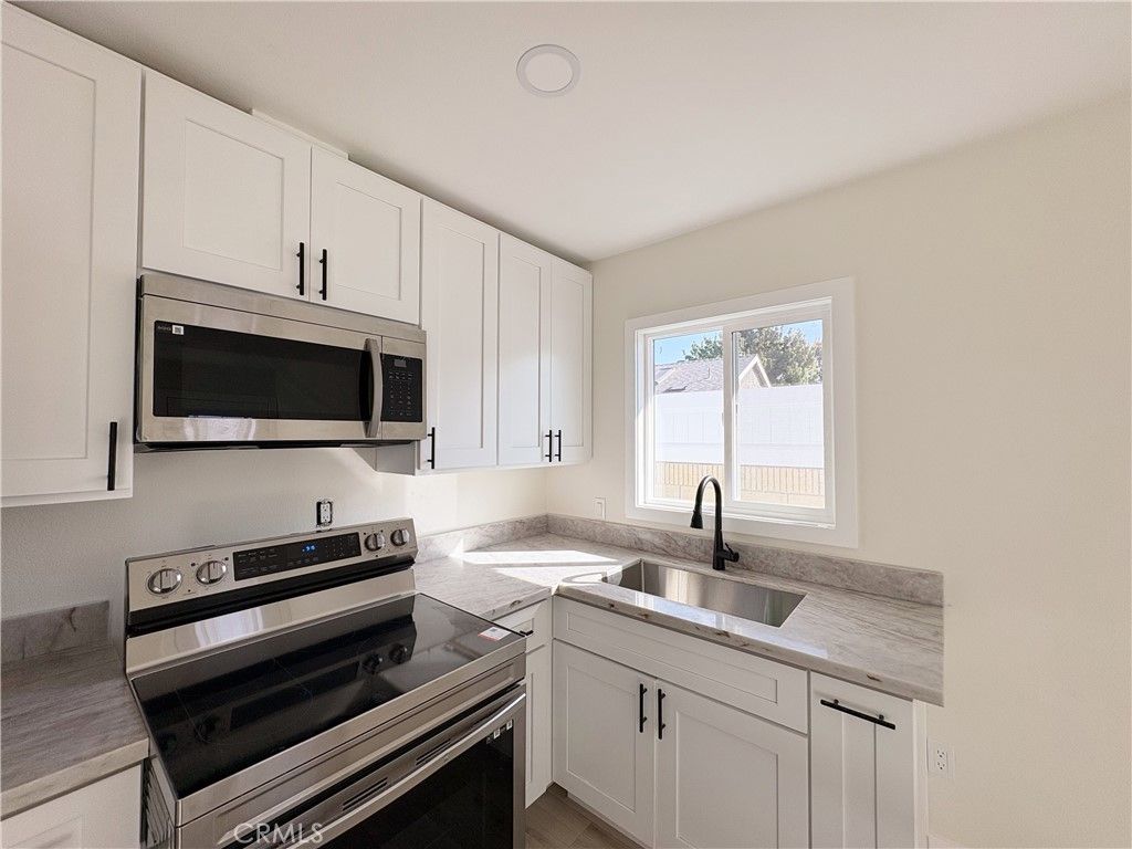 Photo of 6300 Fairbrook Street #1/2, Long Beach, CA 90815 (MLS # BB25245962)