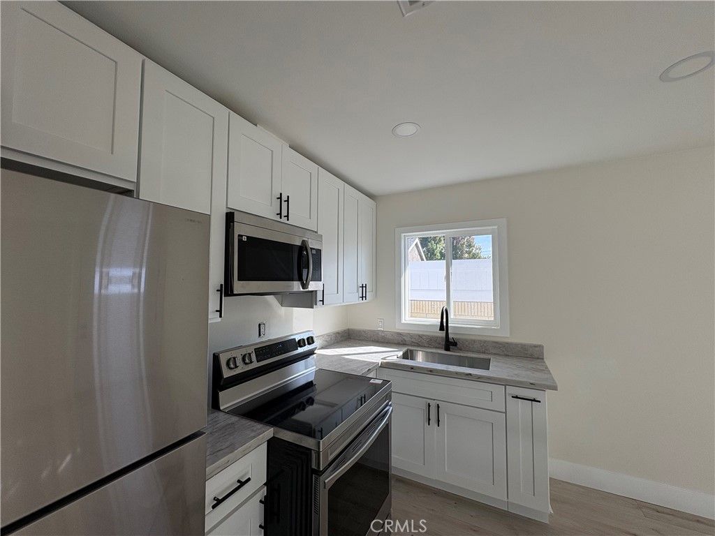 Photo of 6300 Fairbrook Street #1/2, Long Beach, CA 90815 (MLS # BB25245962)