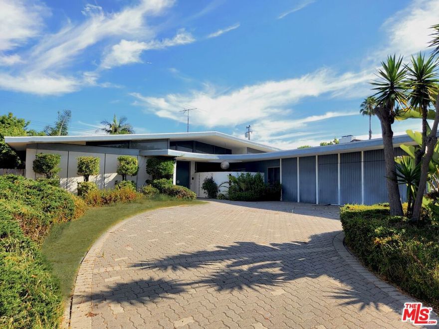 Mid Century Ladera Heights home in original condition with a full circular driveway.  Features a living room with fireplace, family room and formal dining room.  This home has an enclosed patio room that leads to the rear yard with a private pool where you and your guest can enjoy ocean breeze.  Property is in need of full rehab, bring your contractor.  This home is centrally located just minutes from LAX, Beach, Entertainment and Shopping.