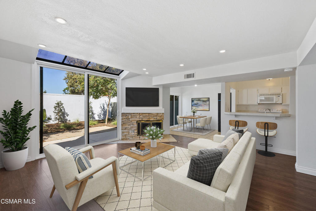 $5000.00 closing cost credit!! Welcome to this beautifully upgraded 2-bedroom, 2.5-bath townhome in the desirable Le Parc community of Simi Valley. This light and bright 1,164 sq. ft. home features an inviting open living room with recessed lighting, a striking stack stone fireplace, and an adjoining dining area. The kitchen offers a breakfast bar, tile countertops, and ample storage, with an indoor laundry room conveniently located nearby. Step outside to enjoy the tranquil, freshly manicured private backyard--perfect for relaxing or entertaining.Upstairs, you'll find two spacious bedrooms with vaulted ceilings, each with its own private bathroom. Brand-new carpeting, fresh interior paint, and high efficiency windows create a move-in ready feel. Additional highlights include laminate flooring downstairs, a convenient half bath, central AC, and a private 2-car garage.The Le Parc community offers resort-style living with two sparkling pool areas, and the location provides some of the best sunset views with easy access to the 118 freeway, shopping, dining, and more. A wonderful opportunity to enjoy comfort, convenience, and style in West Simi Valley!