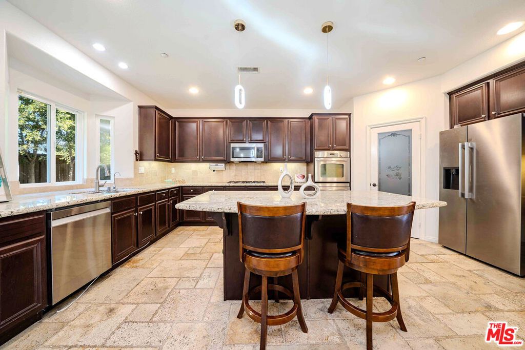 Photo of 9849 Dreams Lane, San Fernando, CA 91345 (MLS # 26668977)