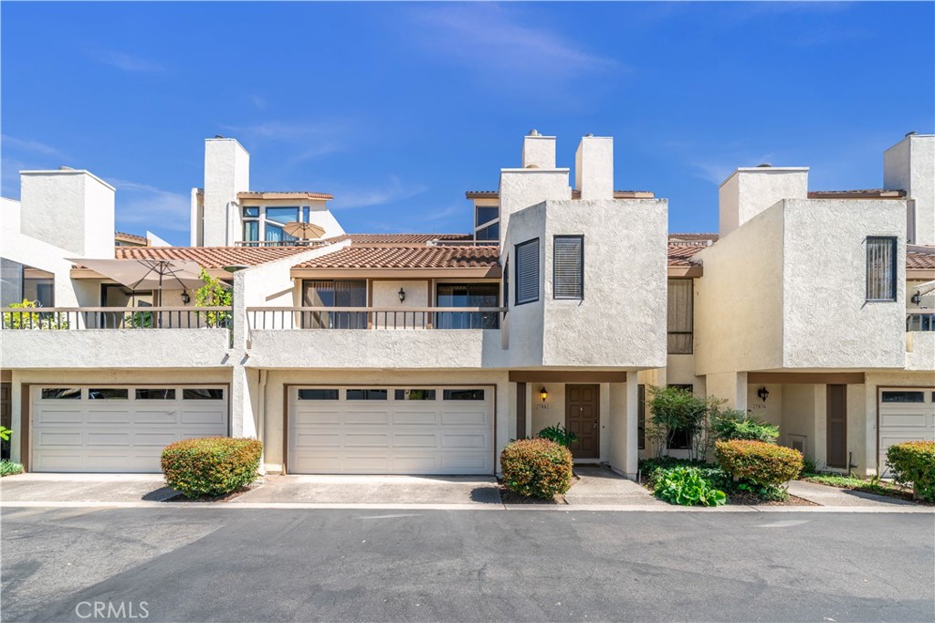 BEAUTIFUL 2-STORY TOWNHOUSE NEWLY REMODELED THIS YEAR, LIVING SPACE ALL ON ONE LEVEL, NO ONE ABOVE OR BELOW, RARE 2-CAR DIRECT ACCESS GARAGE WITH ADDITIONAL STORAGE SPACE, AND ONLY ONE BUILDING AWAY FROM MISSION VIEJO LAKE WITH SWIMMING BEACH AND BOAT DOCK! Open floor plan with high cathedral ceilings, recessed lighting, large windows, and wide outdoor deck with sliding glass doors to living room and primary bedroom. Home is newly painted white with warm green undertones and has luxurious wide Laminate plank waterproof flooring throughout. Living room with fireplace and new white oak cabinets and shelves is open to dining room with recessed lighting and has open doorway to a separate office with windows on two sides that can be used as a guest bedroom. Beautifully and newly remodeled kitchen with breakfast bar, recessed lighting, quartz countertops, white oak cabinets and shelves, farmhouse sink, stainless steel dishwasher and gas range with vented exhaust hood, is open to kitchen dining area that has a laundry closet with more white oak cabinets, and a sliding glass door to atrium. Off the living room is the spacious primary bedroom with walk-in closet and newly remodeled primary bathroom with quartz countertop and white-oak cabinets on the vanity, and bathtub with upscale tiled shower. At the end of the hall are ceiling-to-floor new white oak cabinets, a second bedroom with recessed lighting and sliding glass door to the atrium, and hall bathroom also newly remodeled with quartz countertop and white-oak cabinets on the vanity, and bathtub with upscale tiled shower. Switches and outlets are new everywhere but garage, all internal doors and doorknobs, faucets and towel racks are new, and window blinds in office and stairs are new. Lots of storage space in the many cabinets and in garage. Resort-style community with pool, outdoor barbeques, seating and picnic tables, and direct lake access for swimming, paddleboarding and more! Located in highly acclaimed Capistrano Unified School District! Conveniently located near shopping, entertainment, and 5 and 241 freeways. Water, trash and exterior maintenance included in HOA dues. A wonderful opportunity!