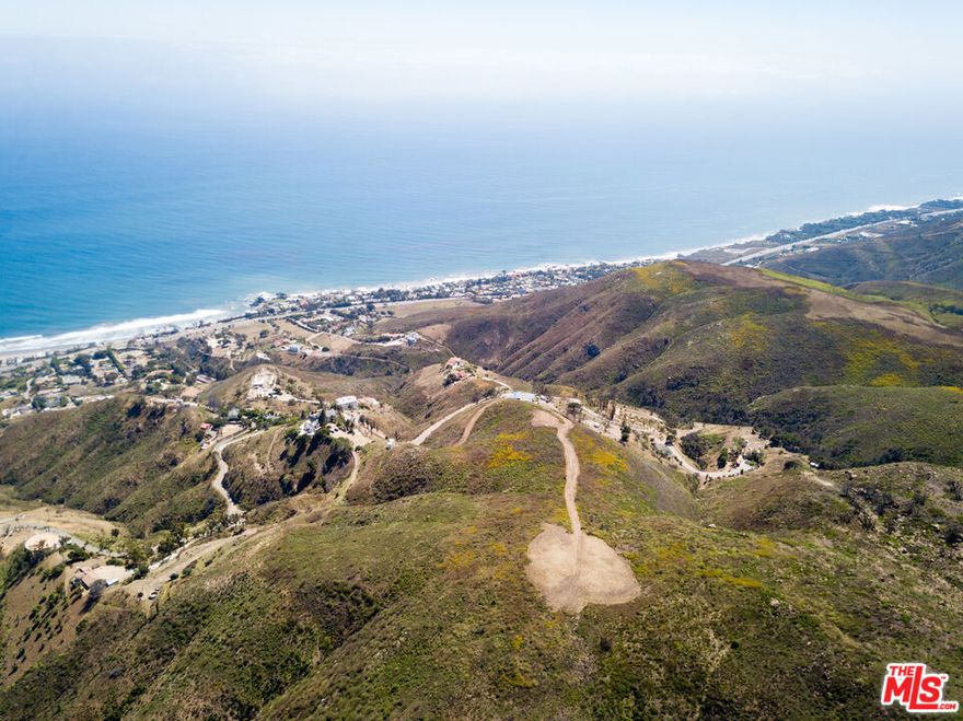 Welcome to the top of the world in Western Malibu. Spanning nearly 36 acres at the crest of the Santa Monica Mountains, this extraordinary property showcases commanding 270-degree views of Point Dume, Catalina Island, the Channel Islands, and the iconic Malibu coastline. Planning Department approval for a 12,740 square foot Mediterranean-inspired estate and a 20-foot wide driveway are designed to take full advantage of this remarkable setting. The plans include a 9,293 square foot two-story residence with a 3-car garage, a 3,000 square foot basement with an indoor pool, gym, and sauna, an infinity pool, and a detached guest house. A private 630-foot well is already in place, and there are code compliance approvals for architectural, structural, mechanical, electrical, plumbing, and grading plans, along with an expired Coastal Development Permit for the residence, driveway, grading, pool, septic, and landscaping. Located just 10 minutes from Trancas Country Market and Zuma Beach, and under 40 minutes from Camarillo Airport, this property offers rare seclusion without sacrificing accessibility. With plans and various reports/studies already in hand, this is an unprecedented opportunity to create a landmark estate with the most spectacular views in Malibu, in a setting that redefines coastal luxury. Adjacent parcel also for sale at 31539 Anacapa View Drive (APN: 4471-027-020).