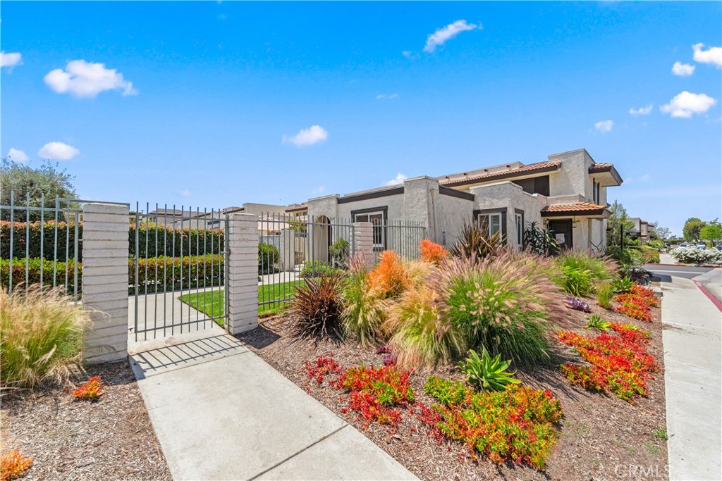 Welcome to the highly sought-after Cypress Monterey gated community! This charming single-level 2-bedroom, 2-bath end-unit condo offers privacy, comfort, and convenience with only one shared wall and a direct-access 2-car garage. Step inside to find dual-pane windows with classic white shutters, allowing you to control the light and privacy to suit your mood. The spacious primary suite features a remodeled en-suite bathroom and a generous walk-in closet for all your essentials. The hallway bath includes a tub and shower combo, perfect for guests or family. The bright kitchen offers a cozy spot to sip your morning coffee while gazing out at your private patio - your own little outdoor escape. Resort-style amenities include 8 sparkling pools and spas, plus a tennis court. This one checks all the boxes: end unit, single level, and full of perks. Don’t miss your chance to live in this incredible community!